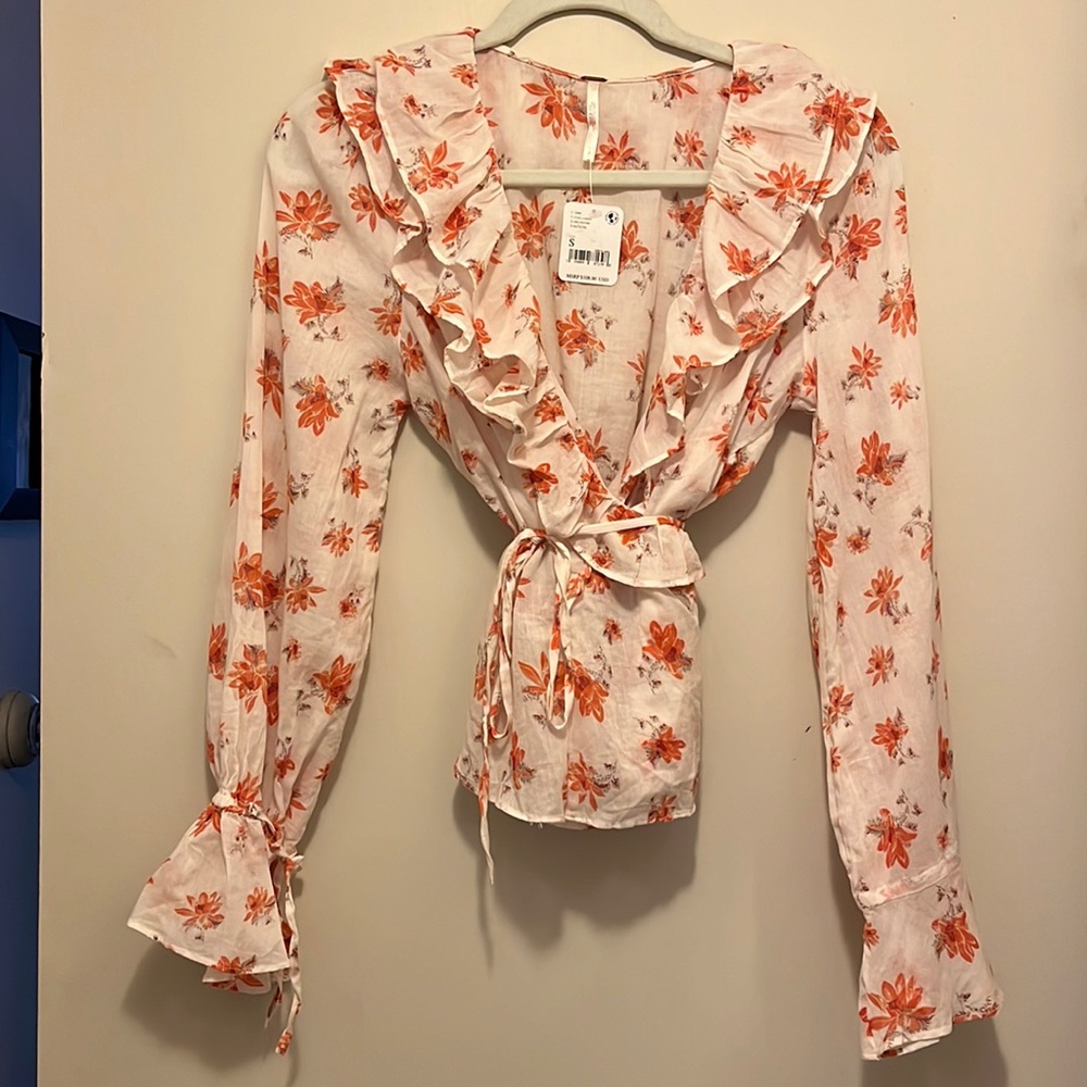 Free People beautiful blouse. New with tags! Size Small
